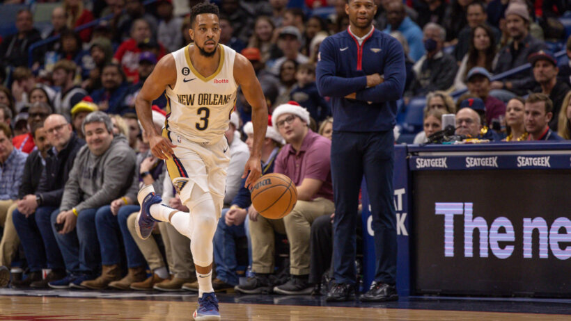 New Orleans Pelicans guard CJ McCollum dribbling up the court