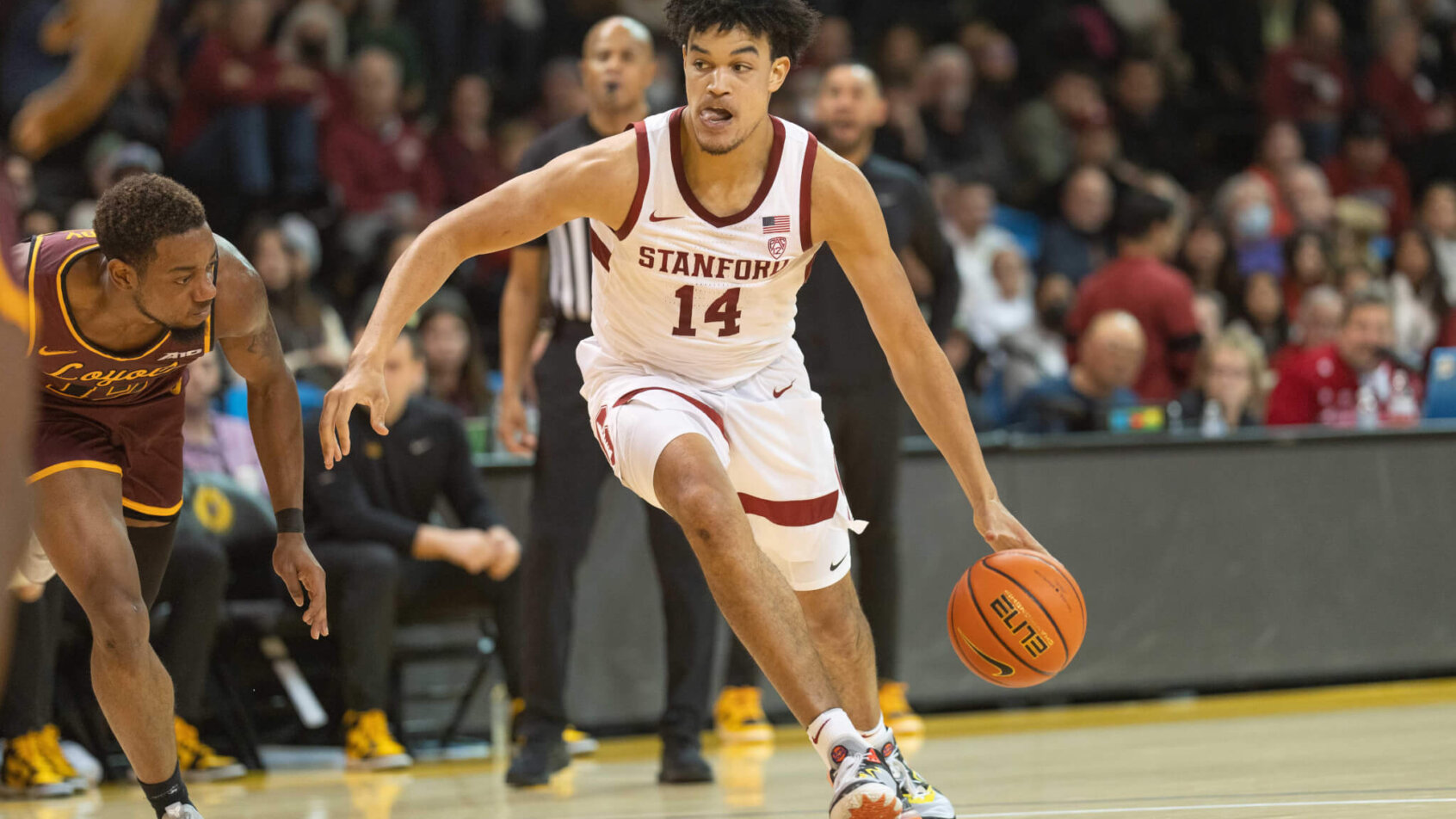 Stanford Cardinal forward Spencer Jones dribbling