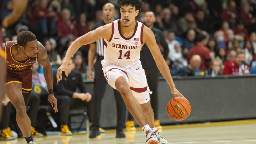 Stanford Cardinal forward Spencer Jones dribbling