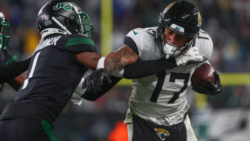 Jacksonville Jaguars tight end Evan Engram runs with ball