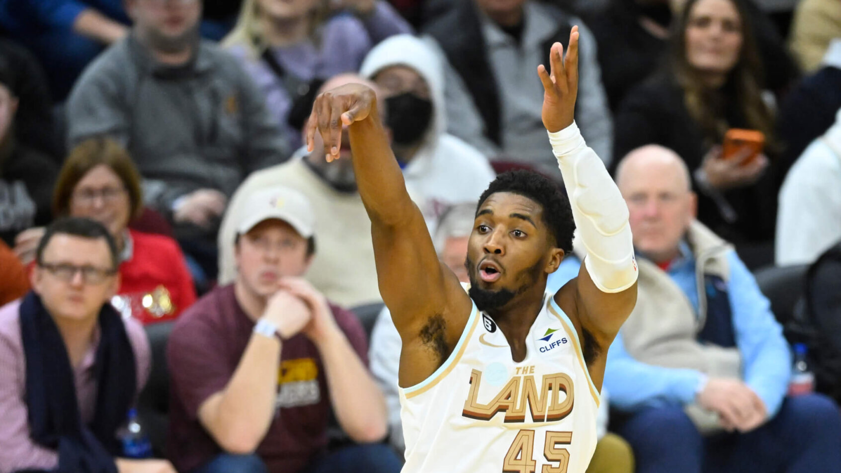 Cleveland Cavaliers Donovan Mitchell follow through on shot basketball white jersey