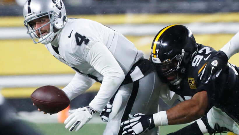 Derek Carr getting tackled