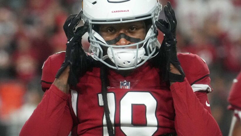 DeAndre Hopkins hands on helmet