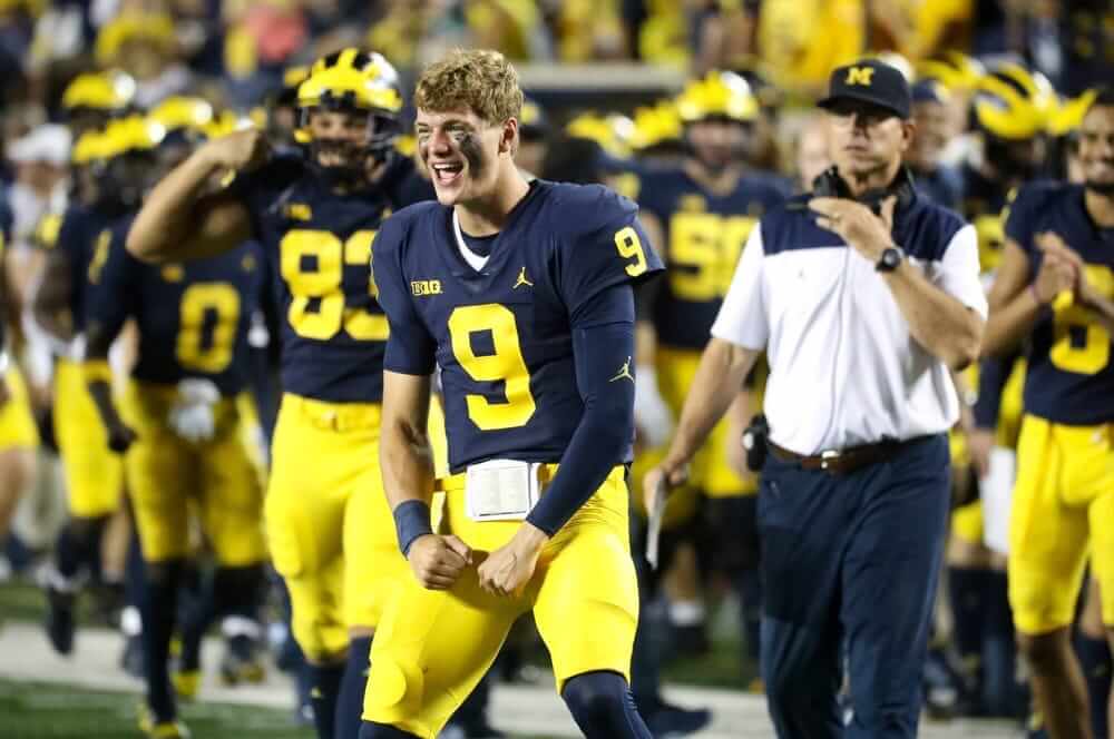 Michigan Wolverines quarterback J.J. McCarthy celebrates on the sidelines