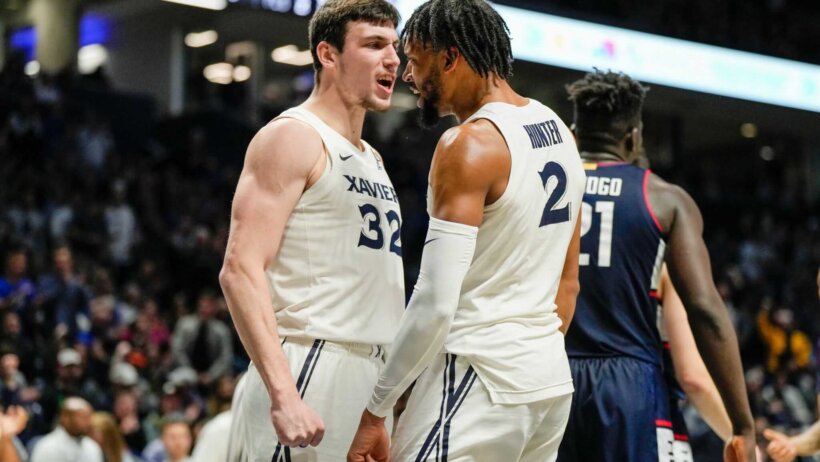 Xavier Musketeers Zach Freemantle and Jerome Hunter celebrate a basket