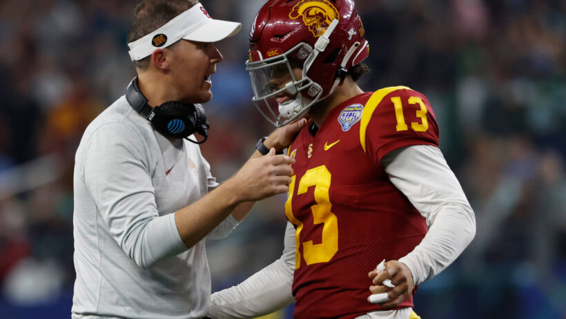 USC Trojans head coach Lincoln Riley talks to quarterback Caleb Williams