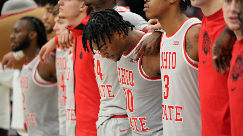 Ohio State Buckeyes stand for national anthem