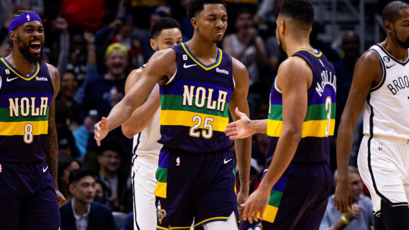 New Orleans Pelicans guard CJ McCollum congratulates guard Trey Murphy III