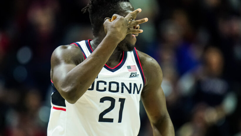 UConn Huskies forward Adama Sanogo gestures after hitting a three
