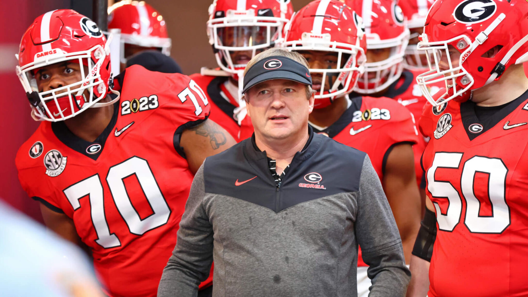 Georgia Bulldogs head coach Kirby Smart leads his team onto the field