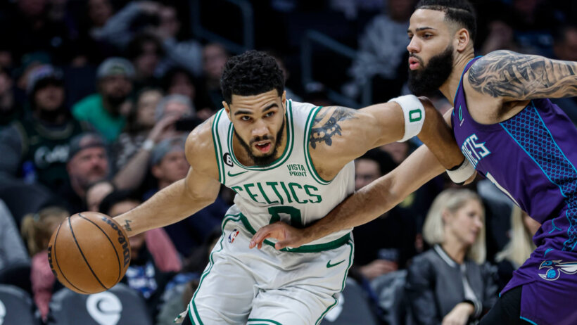 Jayson Tatum drives against the Hornets