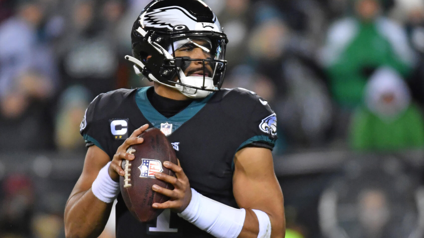 Eagles QB Jalen Hurts looks to pass.