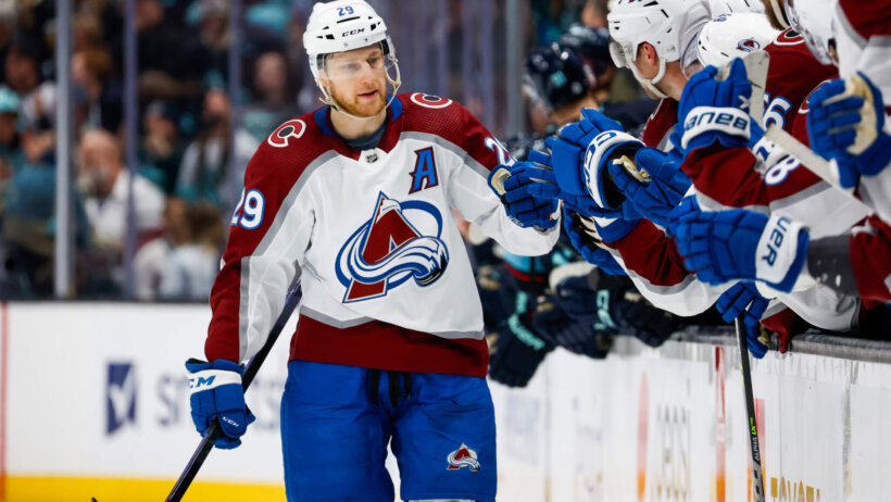 Colorado Avalanche center Nathan MacKinnon celebrates goal with teammates