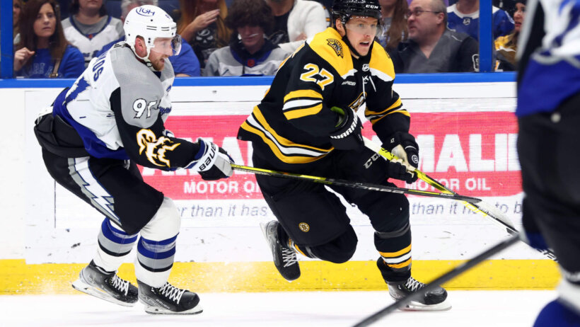 Steven Stamkos of Lightning chasing Bruins Hampus Lindholm