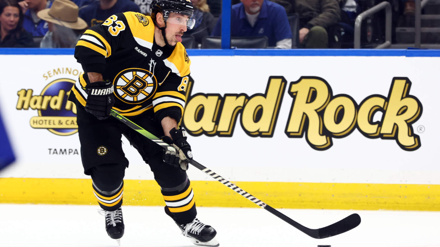 Boston Bruins left wing Brad Marchand skates and scores a goal