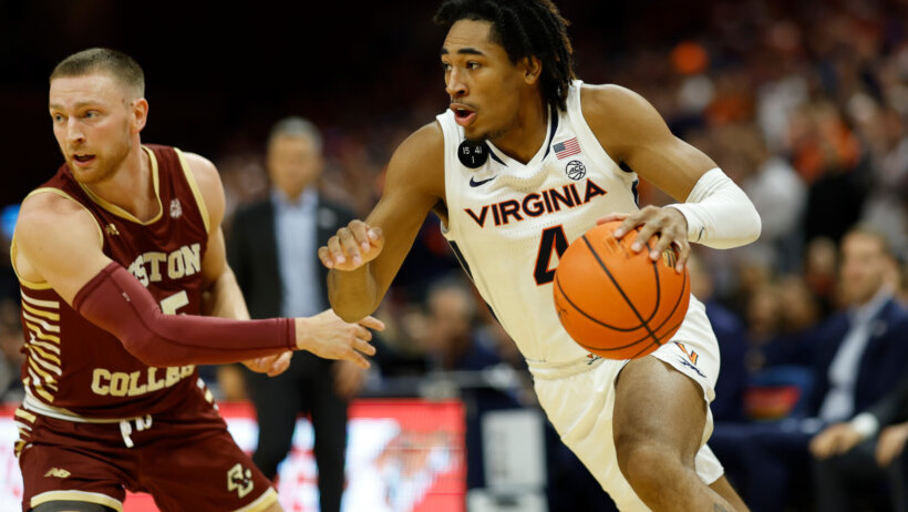 Virginia Cavaliers guard Armaan Franklin dribbles around a defender