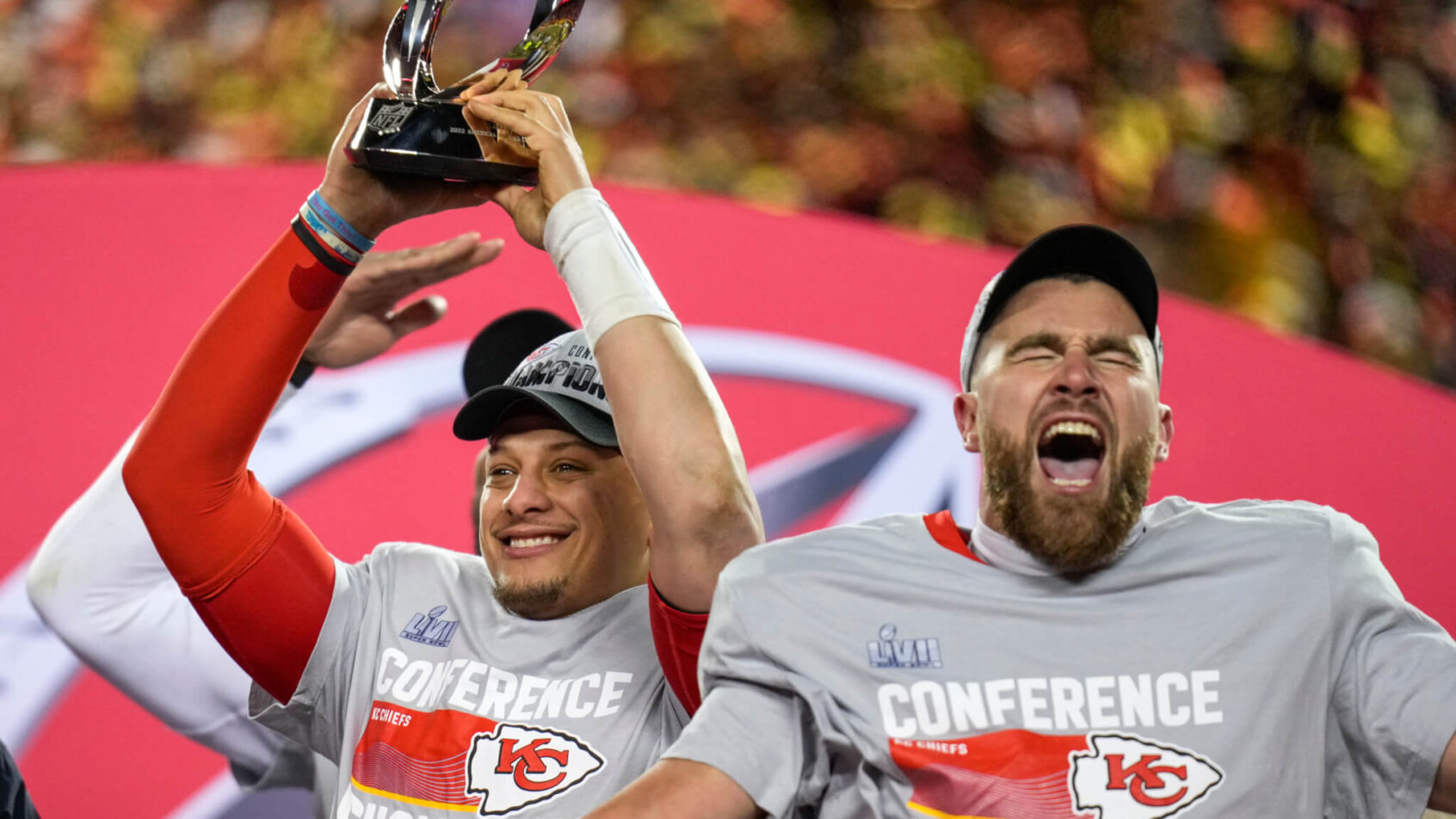 Chiefs players Patrick Mahomes and Travis Kelce celebrate winning the AFC Championship
