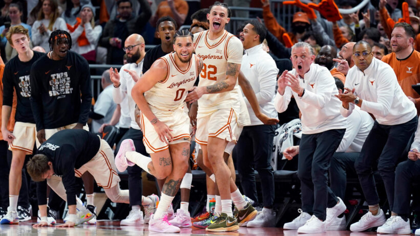 Texas Longhorns forwards Timmy Allen running back down the court