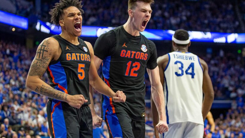 Florida guard Will Richard and forward Colin Castleton celebrate a basket