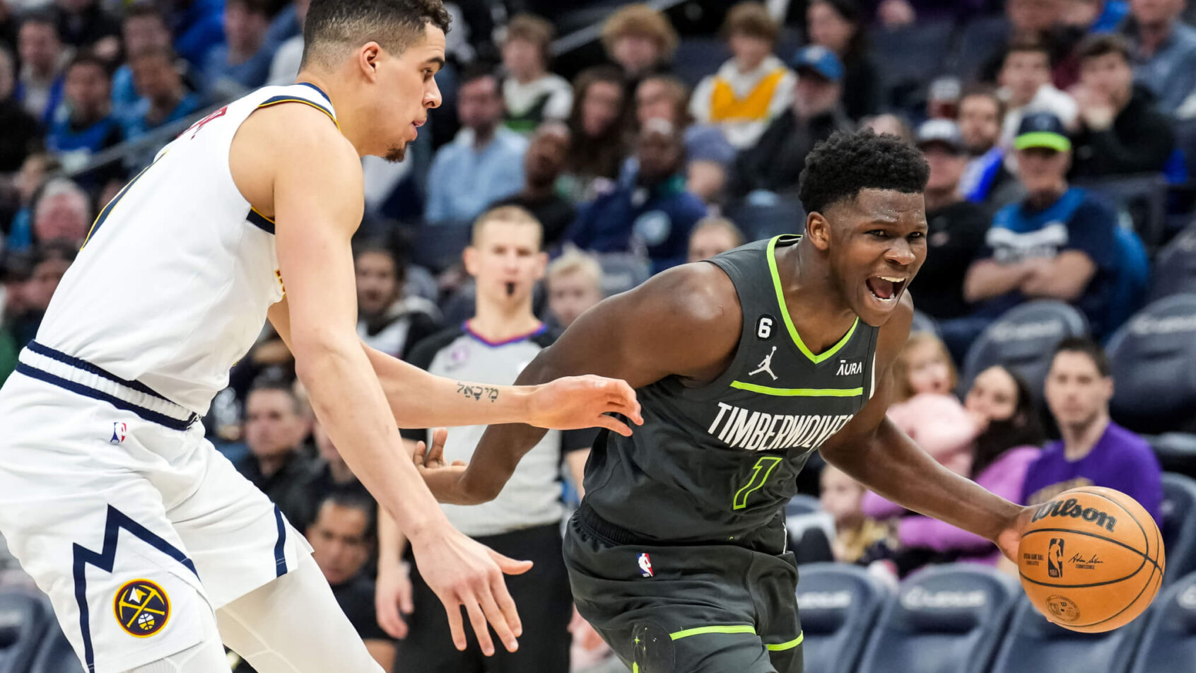 Minnesota Timberwolves guard Anthony Edwards drives past a defender