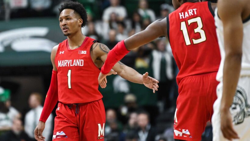 Jahmir Young slaps hands with Hakim Hart