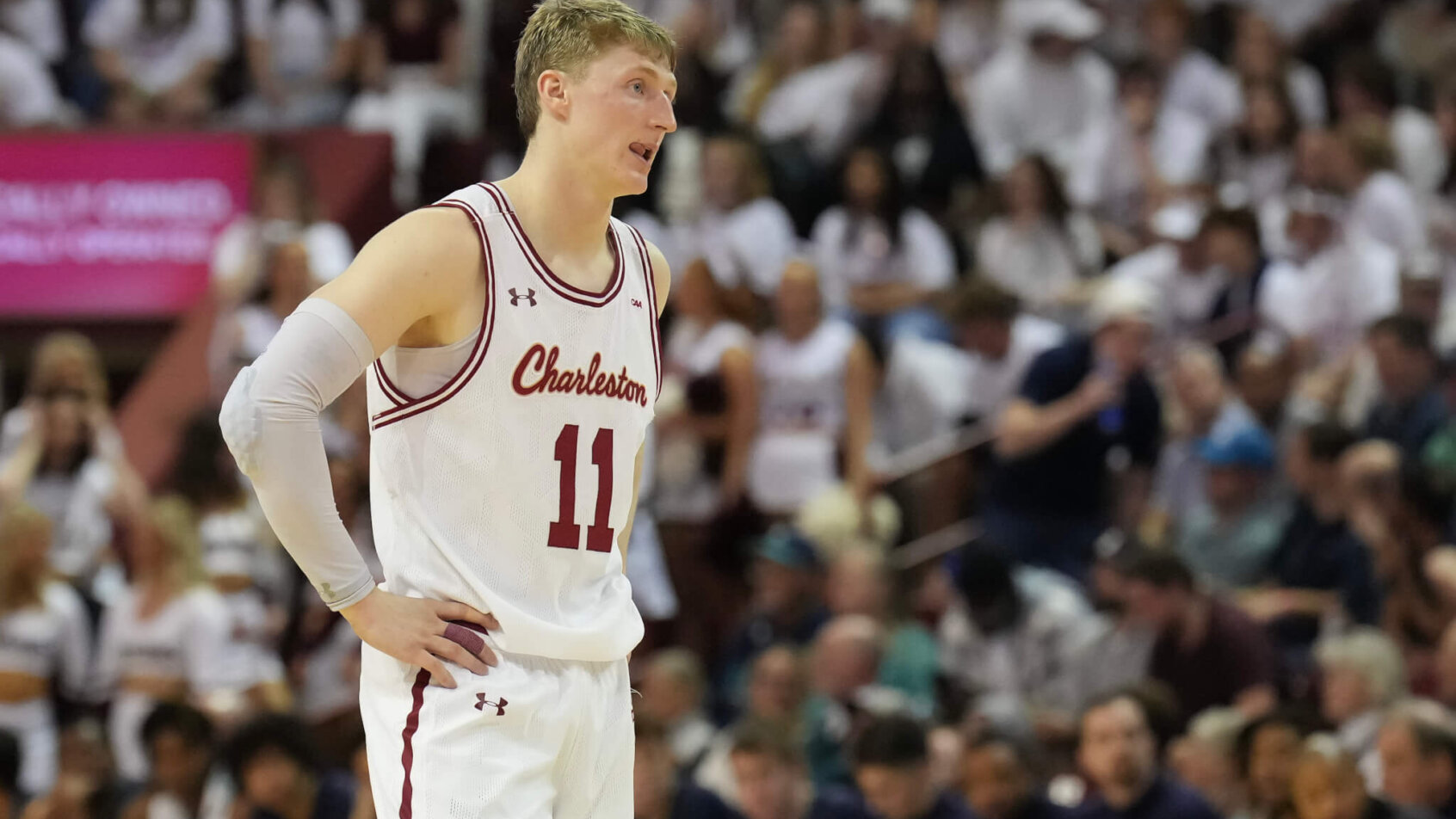 Charleston Cougars guard Ryan Larson stands on the court, hands on hips
