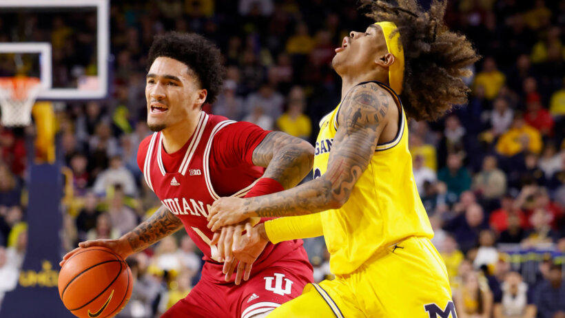 Indiana Hoosiers guard Jalen Hood-Schifino offensive foul against Michigan Wolverines guard Dug McDaniel
