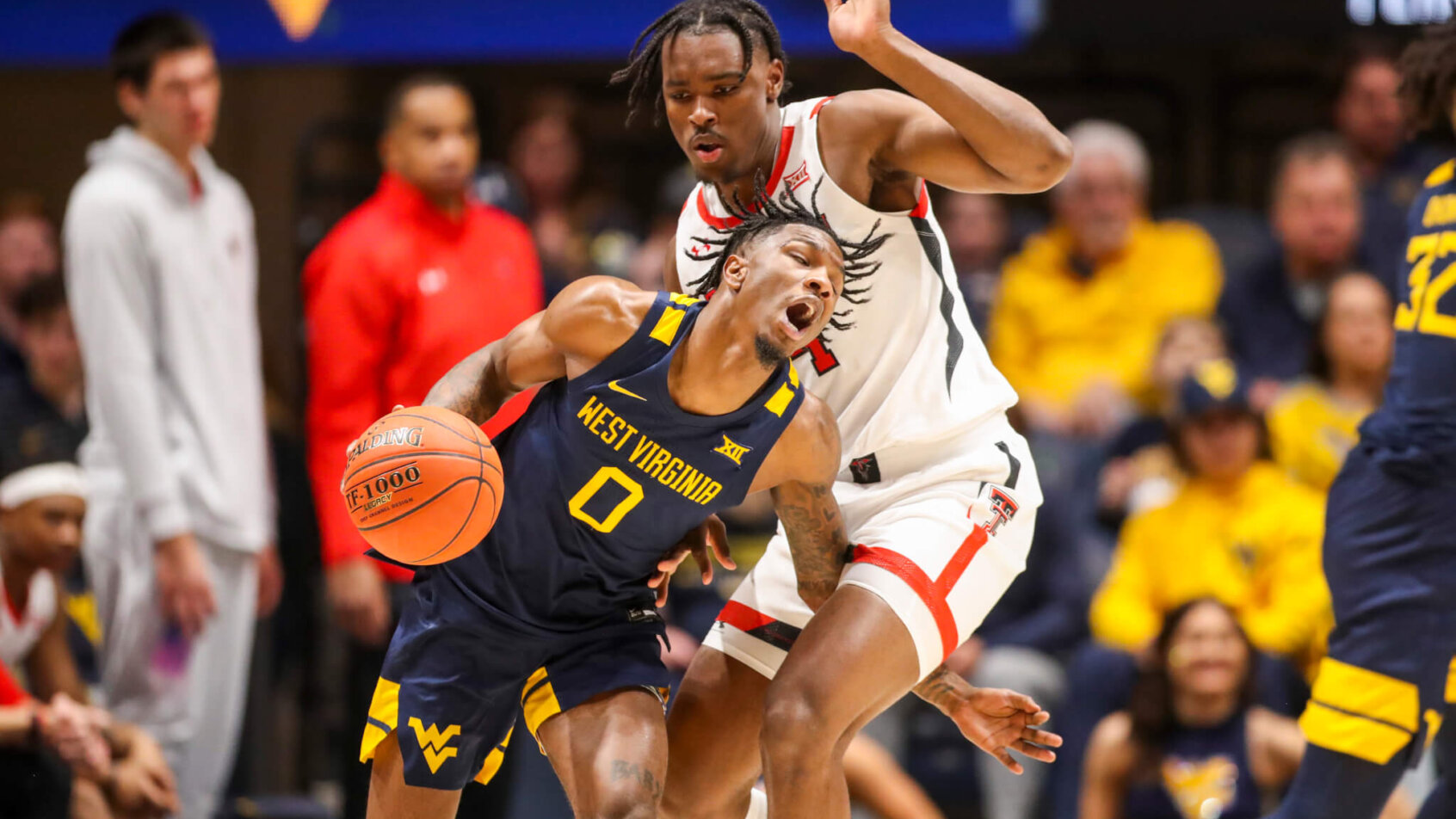 West Virginia Mountaineers guard Kedrian Johnson getting fouled