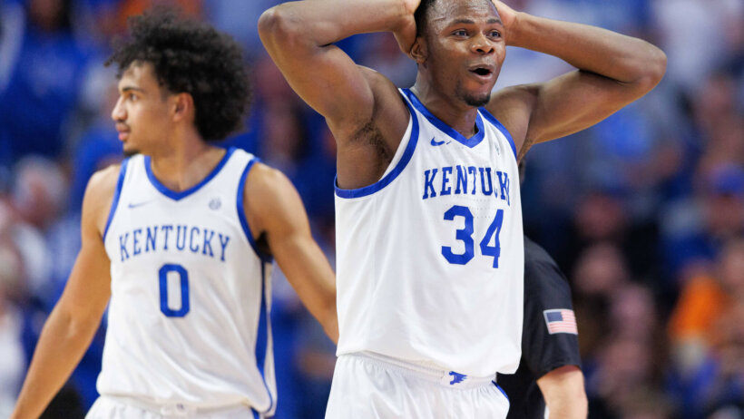 Kentucky Wildcats forward Oscar Tshiebwe with his hands on his head