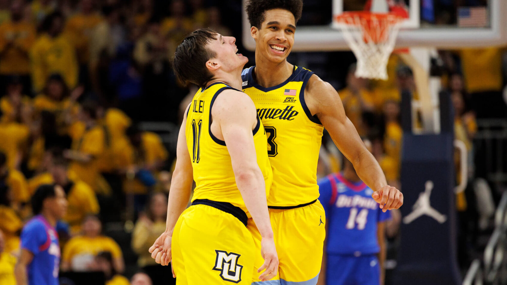 Marquette Golden Eagles forward Oso Ighodaro celebrates with guard Tyler Kolek