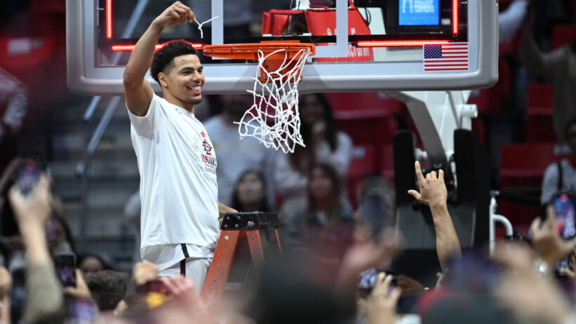 San Diego State Aztecs guard Matt Bradley cuts down the nets after winning Mountain West Tournament
