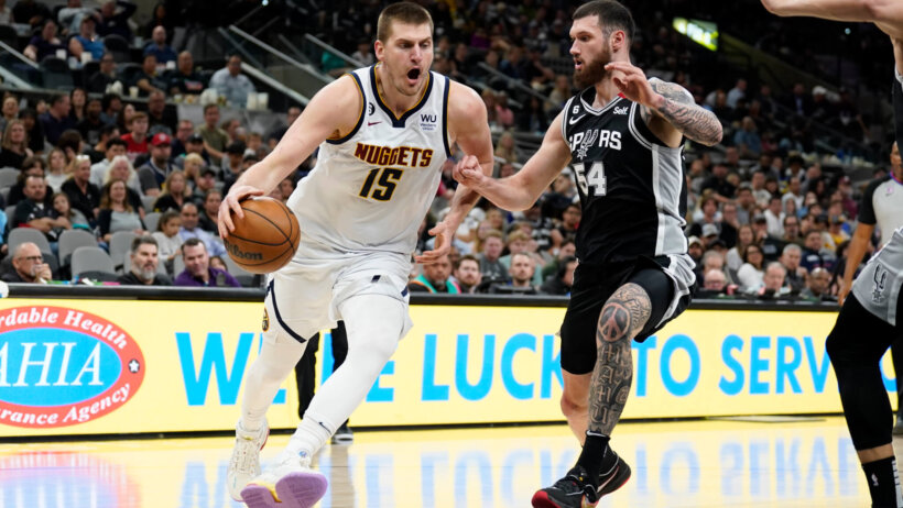 Denver Nuggets center Nikola Jokic (15) drives to the basket