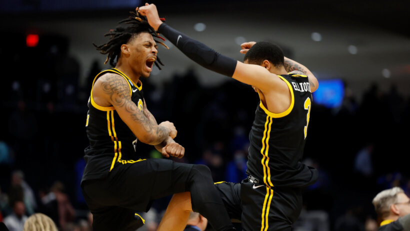 Pittsburgh Panthers guards Nike Sibande and Greg Elliott celebrate a win