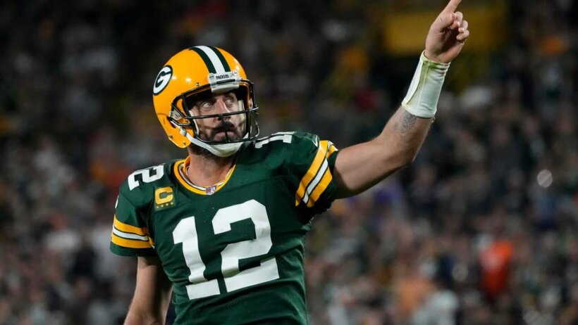 Former Green Bay quarterback Aaron Rodgers pointing