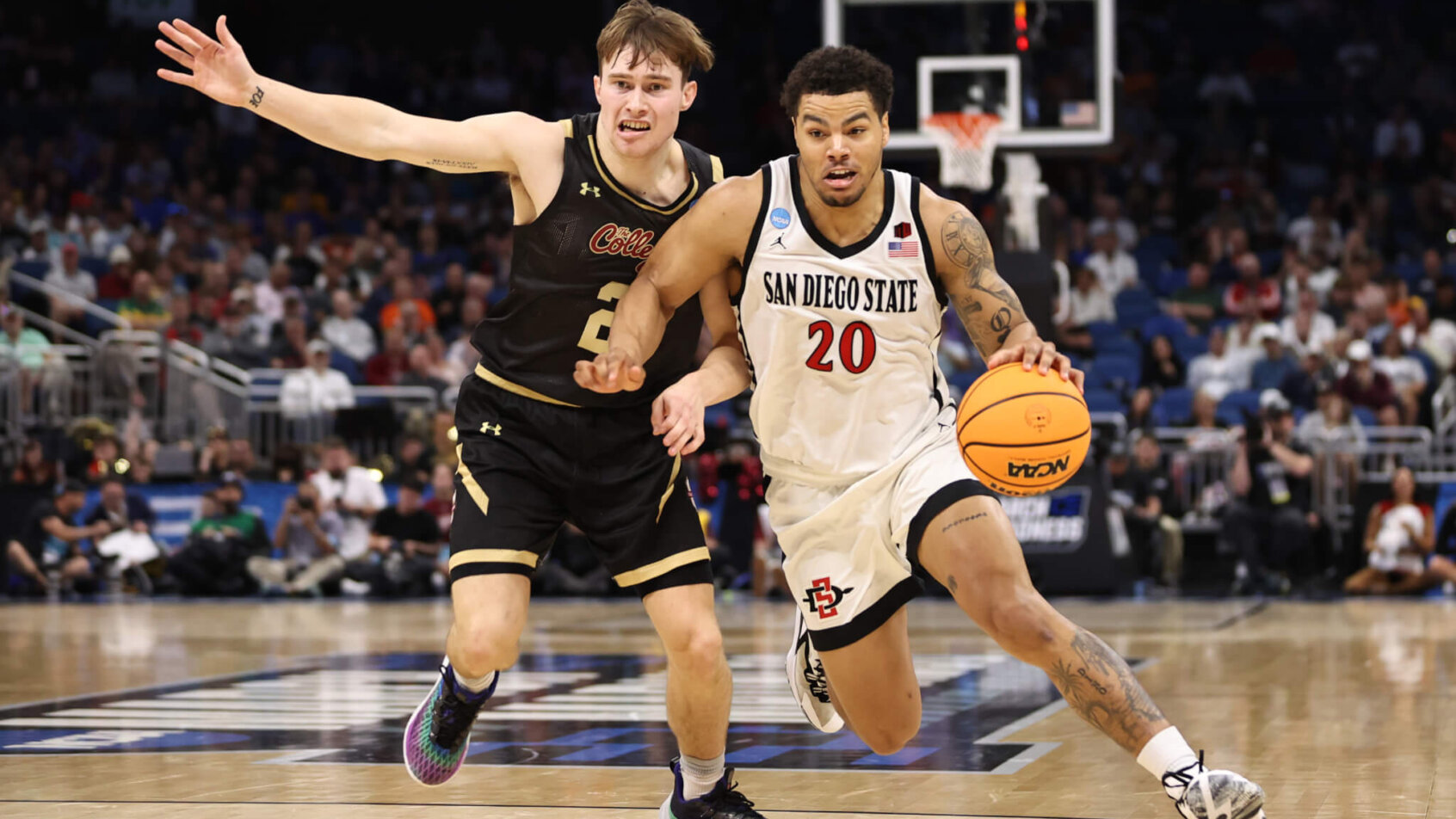 San Diego State Aztecs guard Matt Bradley dribbling around a defender