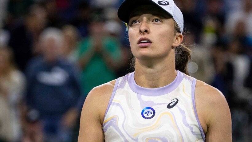 Iga Swiatek of Poland looks up to the chair umpire