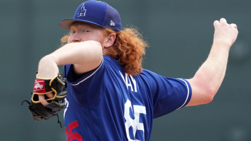 Los Angeles Dodgers starting pitcher Dustin May mid-pitch