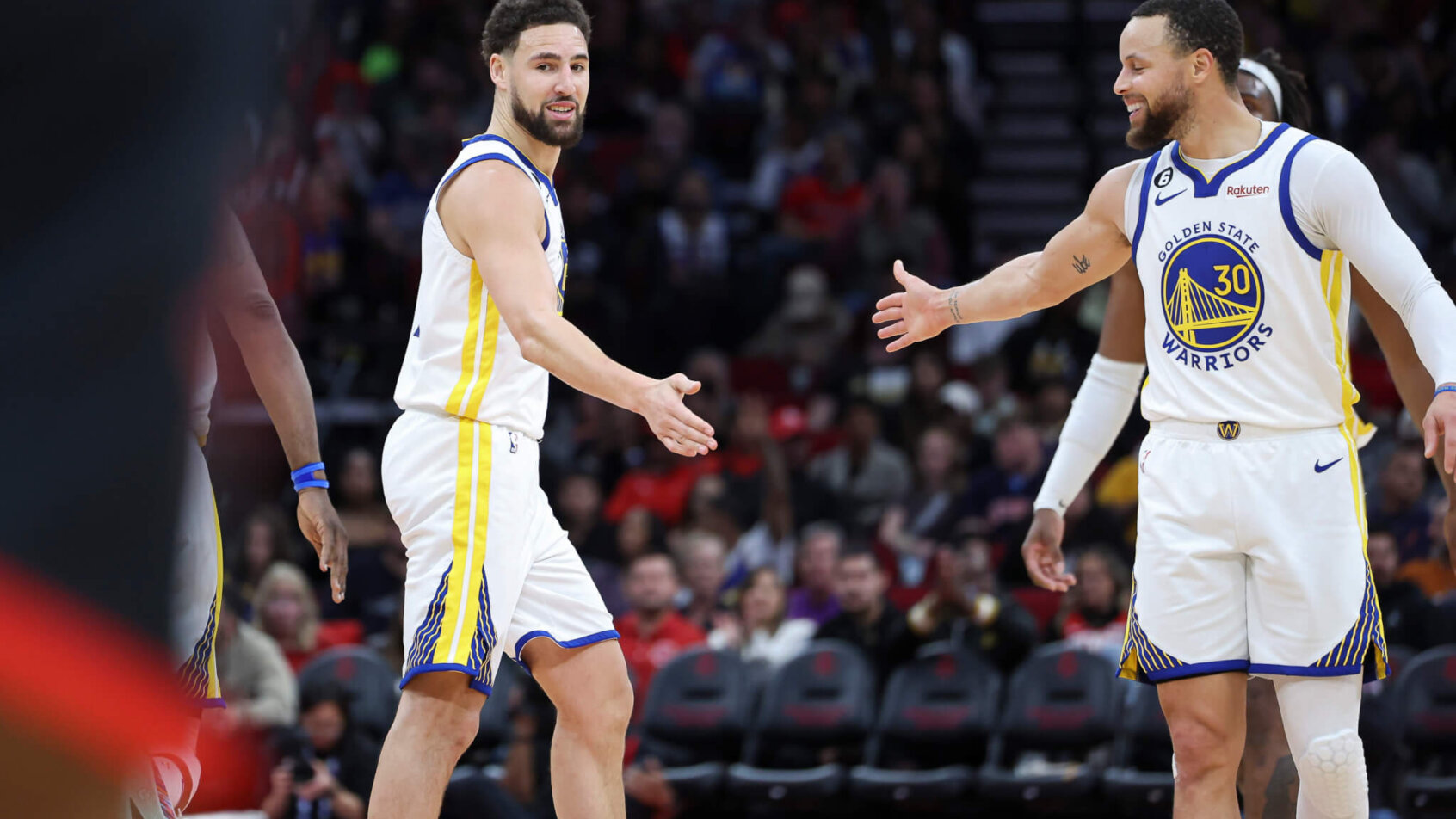 Klay Thompson and guard Stephen Curry high five