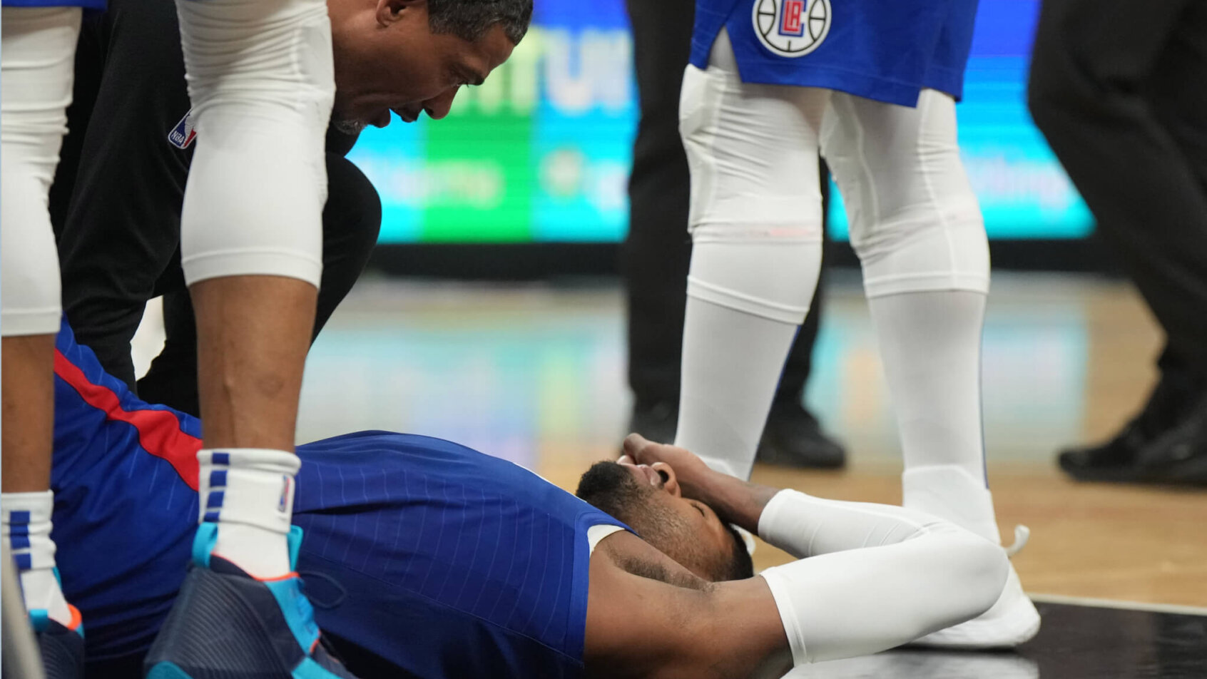 LA Clippers forward Paul George lies on the floor