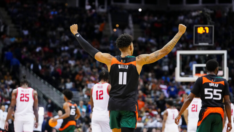 Miami Hurricanes guard Jordan Miller raises his arms