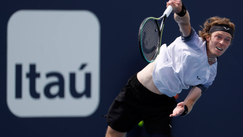 Andrey Rublev serves against Jannik Sinner