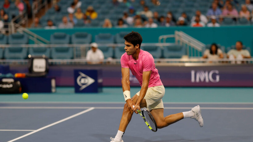 Carlos Alcaraz (ESP) hits a backhand against Taylor Fritz