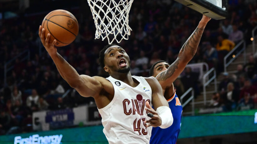 Cleveland Cavaliers guard Donovan Mitchell lays the ball into the hoop