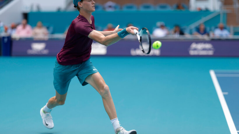 Jannik Sinner (ITA) hits a forehand against Daniil Medvedev