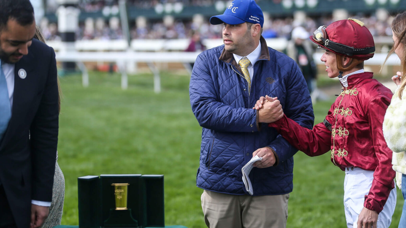 Trainer Brad Cox congratulates jockey Tyler Gaffalione after he piloted Caravel to claim the Shakertown Grade Two stakes