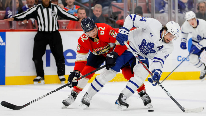 Toronto Maple Leafs center Auston Matthews protects the puck from Florida Panthers defenseman Brandon Montour