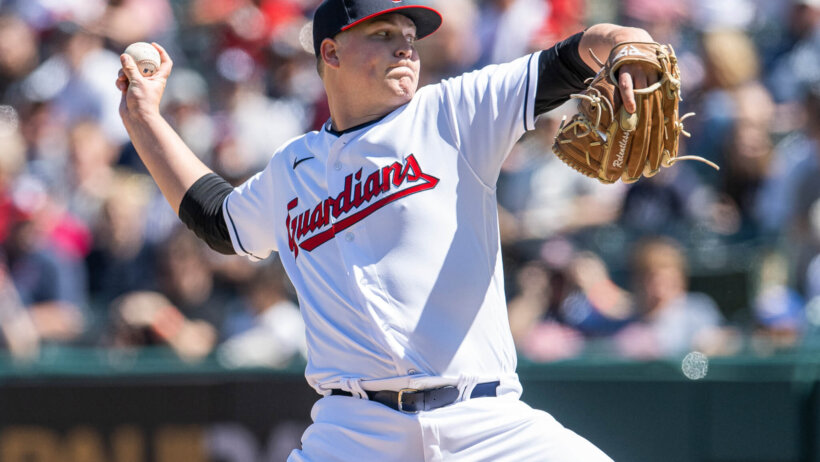 Cleveland Guardians starting pitcher Peyton Battenfield throwing to home