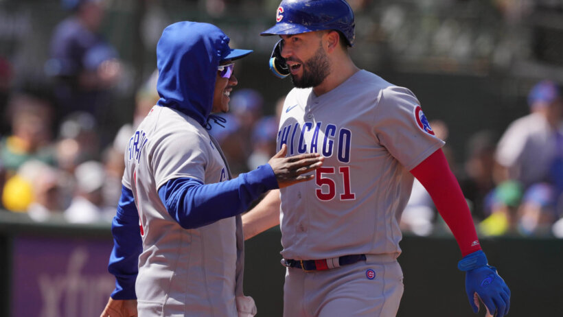 Chicago Cubs first baseman Eric Hosmer celebrates with pitcher Marcus Stroman