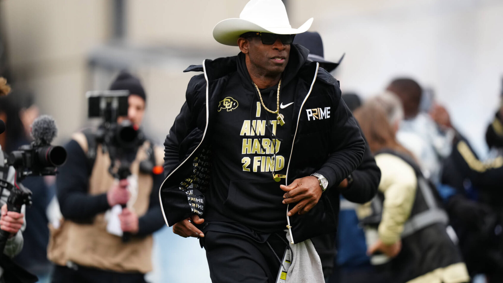 Colorado Buffaloes head coach Deion Sanders hits the field before the start of the spring game
