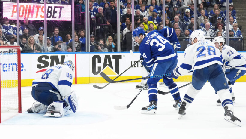 Toronto Maple Leafs center Auston Matthews battles with Tampa Bay Lightning defenseman Ian Cole